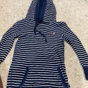 a stripped blue long sleeve w a hoodie